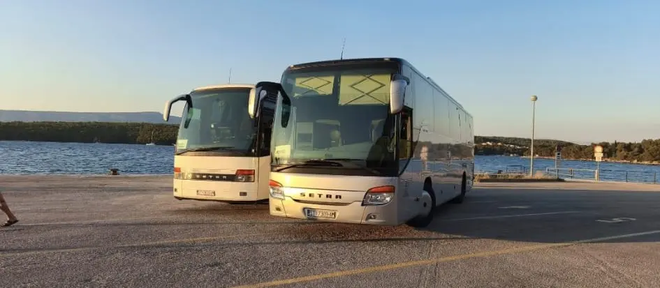 Two Santa Marija Setra coaches by the waterfront